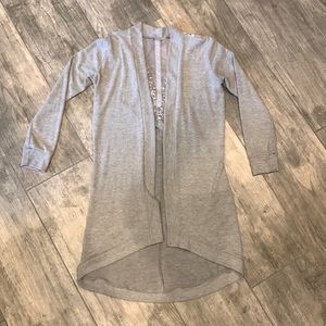 Francesca’s Long lace back cardigan. Soft poly/rayon/spandex